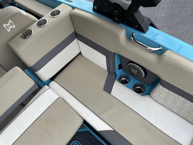 Slide: The Image of Interior of 2022 HEYDAY WAKE BOATS H22 with beige seating and speakers. - 26
