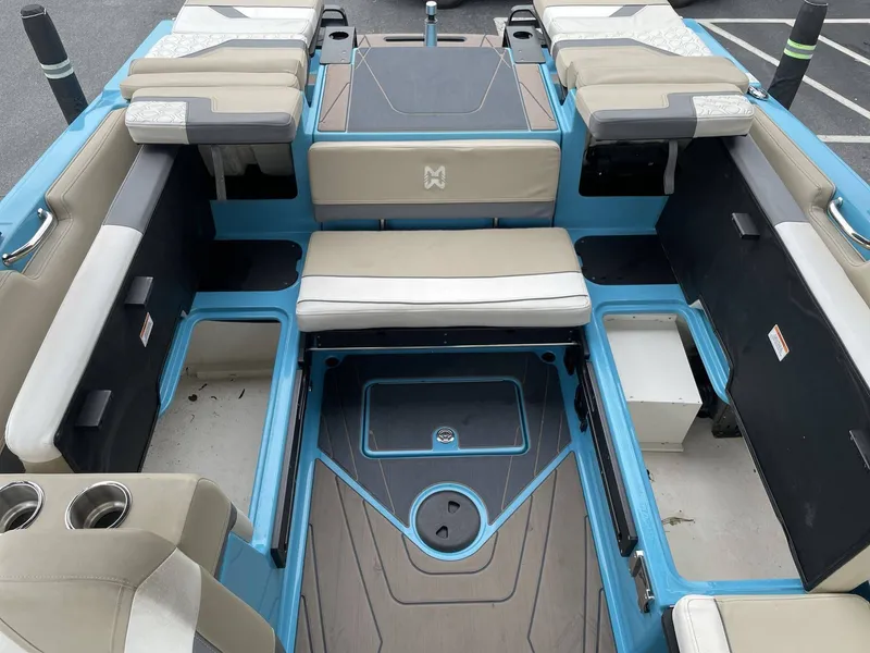 Slide: The Image of Interior of a 2022 HEYDAY WAKE BOATS H22 with blue and beige seating. - 28