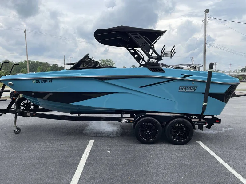 Slide: The Image of 2022 HEYDAY WAKE BOATS H22 on trailer, blue design. - 29