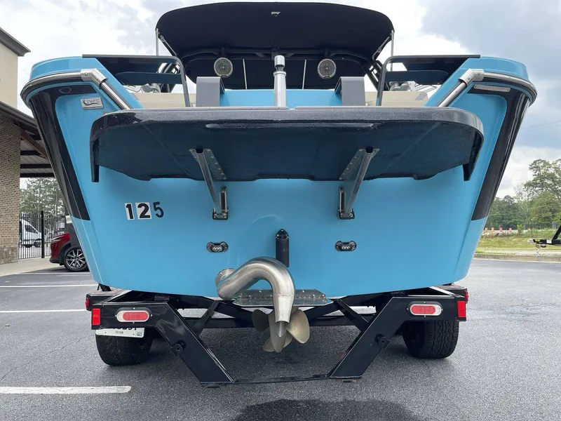 Slide: The Image of Rear view of blue 2022 HEYDAY WAKE BOATS H22 on trailer. - 30