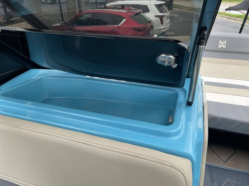 Slide: The Image of Interior view of 2022 HEYDAY WAKE BOATS H22 with blue storage compartment. - 31