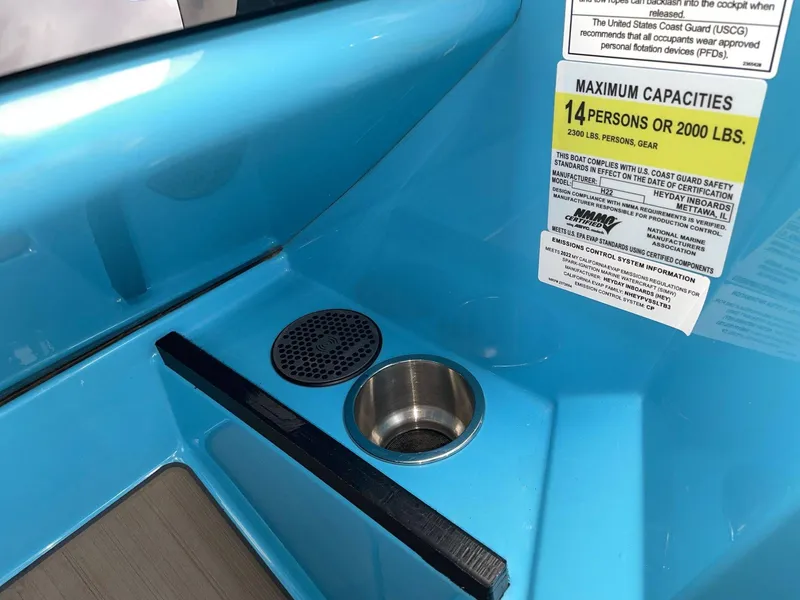 Slide: The Image of Interior of a 2022 HEYDAY WAKE BOATS H22 with capacity label. - 33