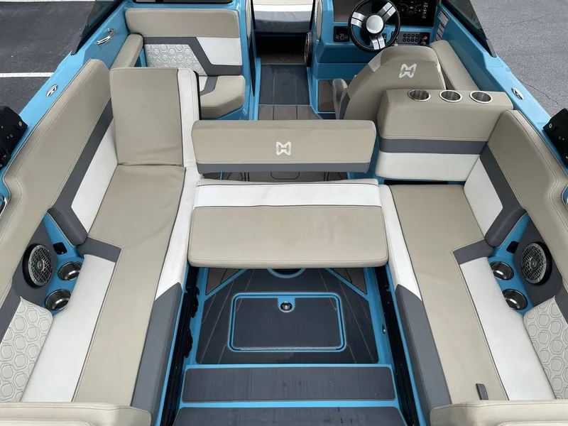 Slide: The Image of Interior of a 2022 HEYDAY WAKE BOATS H22 with beige and blue seating. - 38
