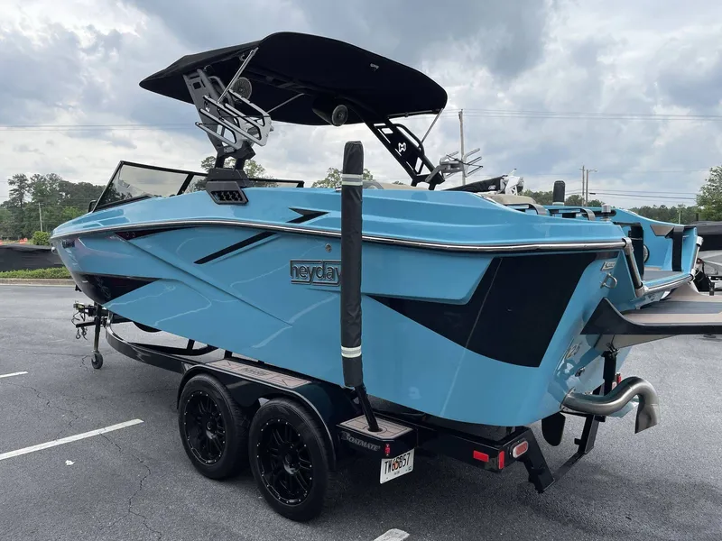 Slide: The Image of 2022 HEYDAY WAKE BOATS H22 in blue on trailer. - 4