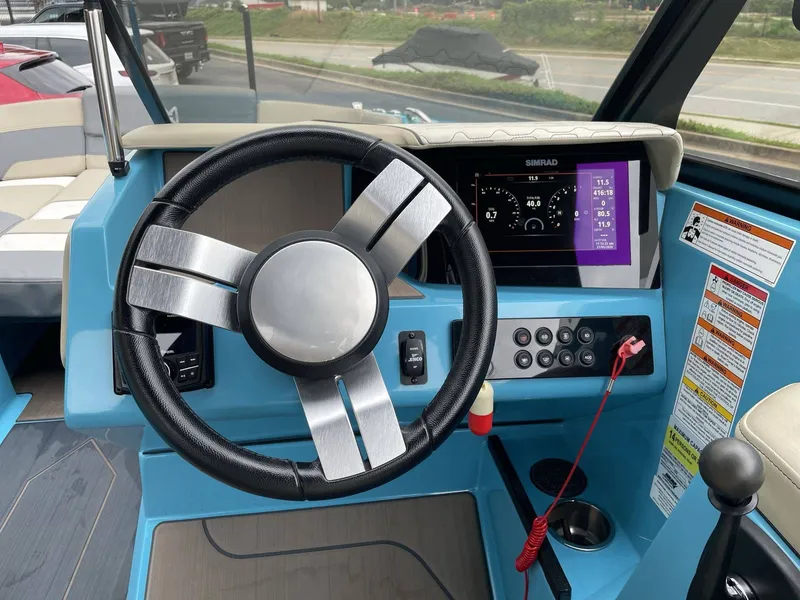 Slide: The Image of Interior view of 2022 HEYDAY WAKE BOATS H22 cockpit with steering wheel and instruments. - 40