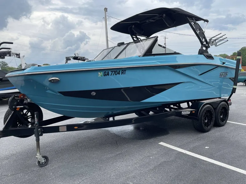 Slide: The Image of 2022 HEYDAY WAKE BOATS H22 on trailer, blue design. - 5
