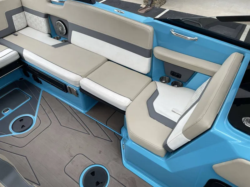 Slide: The Image of Interior of a 2022 HEYDAY WAKE BOATS H22 with blue and gray seating. - 6