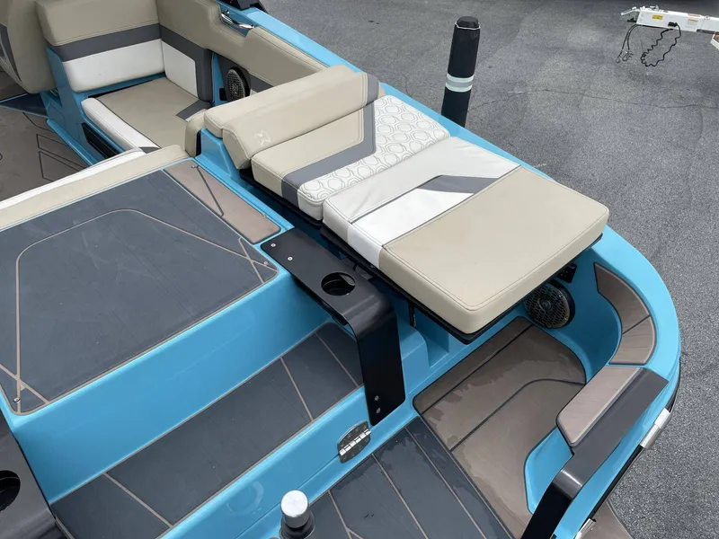 Slide: The Image of Interior of a 2022 HEYDAY WAKE BOATS H22 with blue and beige seating. - 8