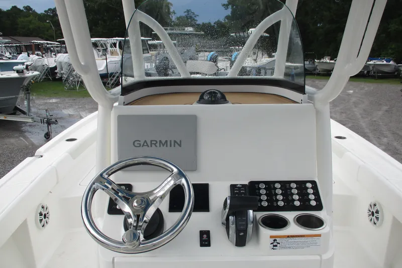 Slide: The Image of 2020 Caymas 28 HB boat dashboard with Garmin navigation system and steering wheel. - 4