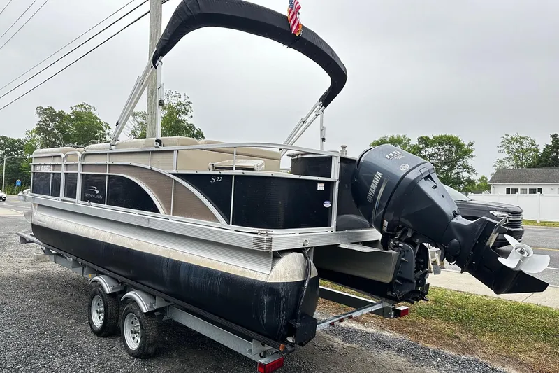 Slide: The Image of 2014 Bennington 2275SL Pontoon boat on trailer with Yamaha outboard motor. - 2