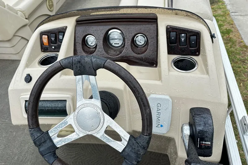 Slide: The Image of Steering console of a 2014 Bennington 2275SL Pontoon with Garmin navigation. - 4