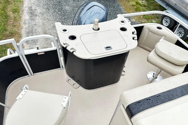 Slide: The Image of 2014 Bennington 2275SL Pontoon boat interior with seating and control panel. - 9