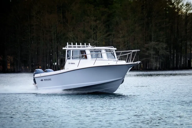 The Image of 2027 Defiance Admiral 250 EX boat cruising on a serene lake. - 1
