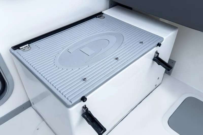 Slide: The Image of Storage compartment on 2027 Defiance Admiral 250 EX boat, featuring a secure latch and durable design. - 6