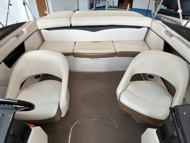 Slide: The Image of Interior of a 2008 Four Winns H210 boat with white seating. - 10