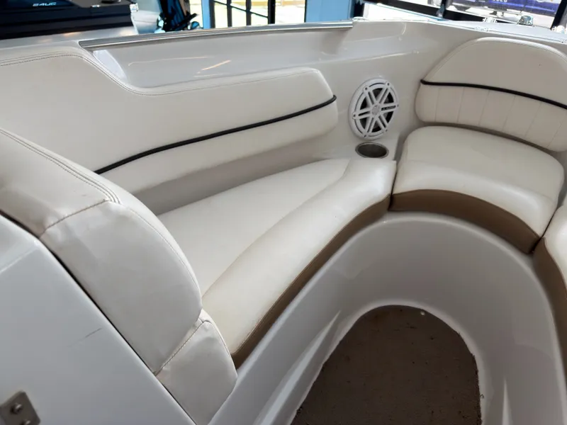 Slide: The Image of Interior of a 2008 Four Winns H210 boat with white seating. - 12