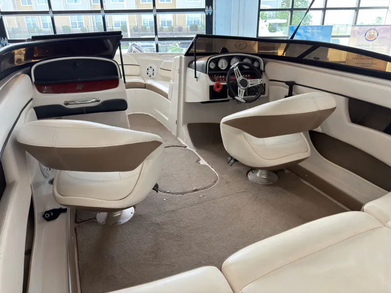 Slide: The Image of Interior of a 2008 Four Winns H210 boat with beige seating. - 6