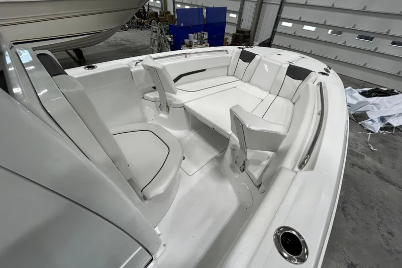 Slide: The Image of 2026 Wellcraft 243 Fisherman boat interior with white seating and modern design. - 12