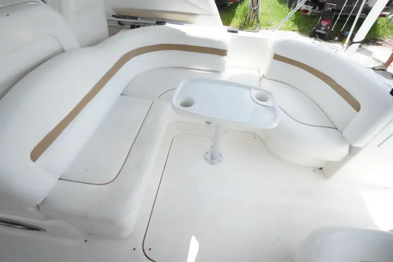 Slide: The Image of 2008 Sea Ray 380 Sundancer interior with white seating and table. - 10