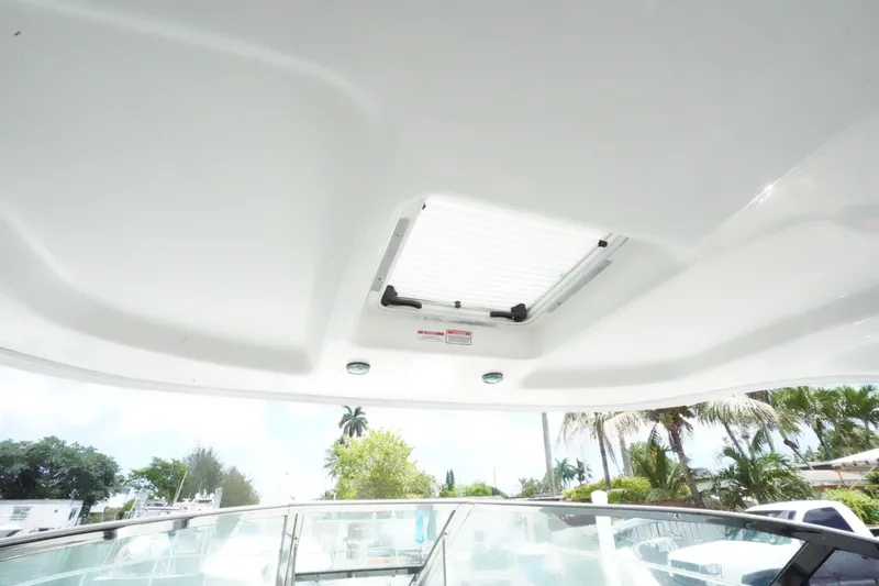 Slide: The Image of 2008 Sea Ray 380 Sundancer sunroof view with tropical background. - 12