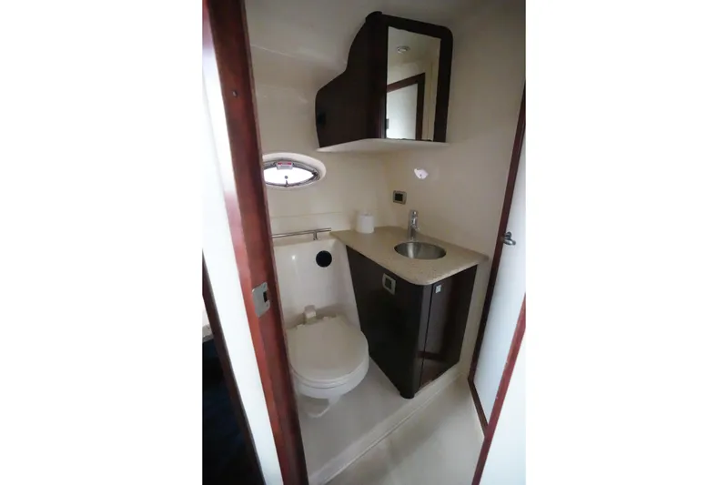 Slide: The Image of Luxurious bathroom in 2008 Sea Ray 380 Sundancer yacht, featuring modern fixtures and compact design. - 13