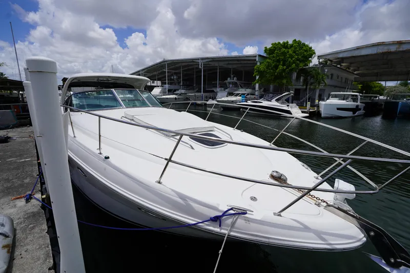 Slide: The Image of 2008 Sea Ray 380 Sundancer yacht docked at marina under cloudy sky. - 14