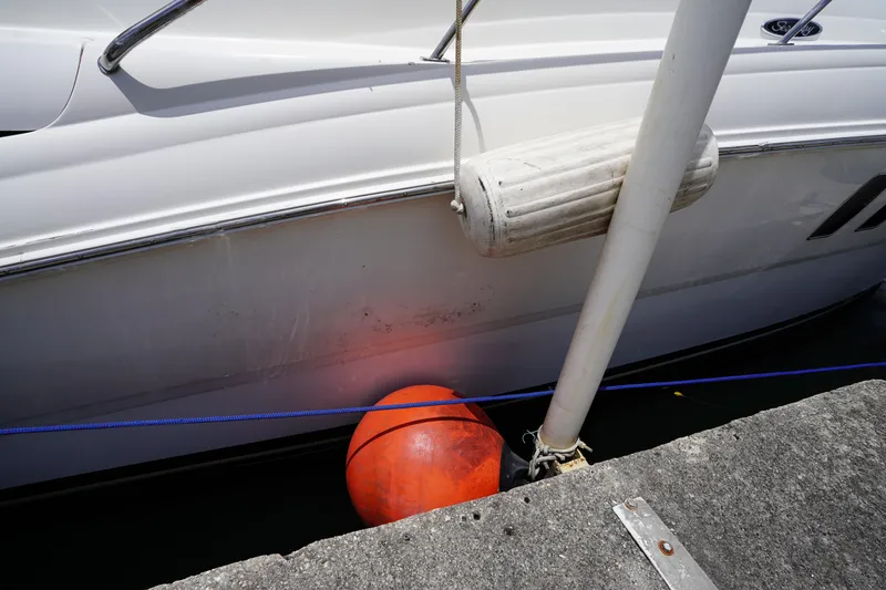 Slide: The Image of 2008 Sea Ray 380 Sundancer docked with fender and buoy for protection. - 19