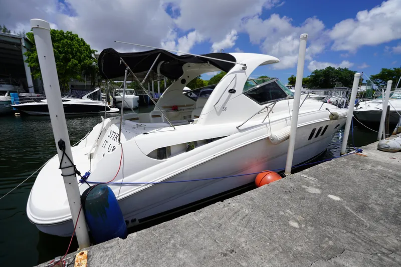 Slide: The Image of 2008 Sea Ray 380 Sundancer docked at marina under clear blue sky. - 4