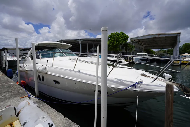Slide: The Image of 2008 Sea Ray 380 Sundancer docked at marina under cloudy sky. - 5