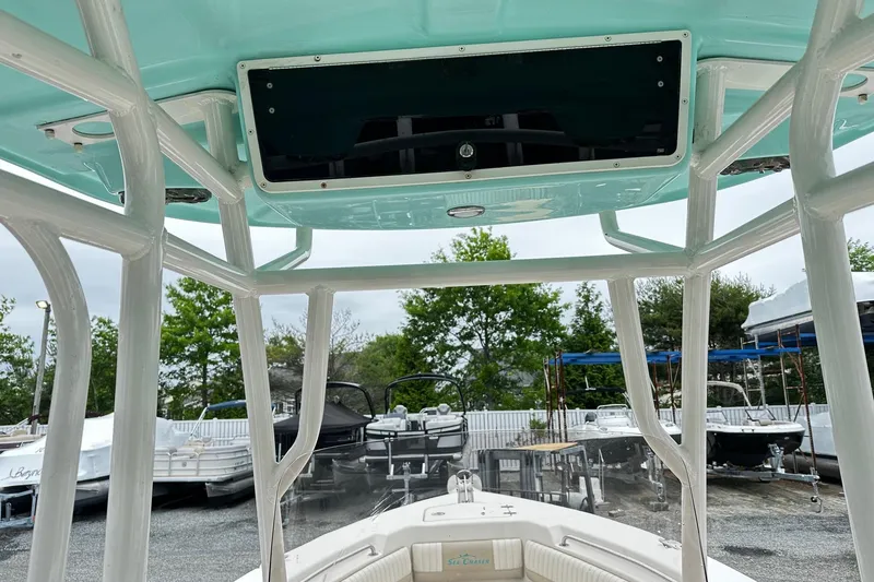 Slide: The Image of 2017 Sea Chaser 22 HFC boat interior with T-top and seating area. - 7