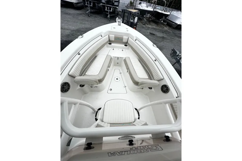 Slide: The Image of 2017 Sea Chaser 22 HFC boat interior with white seating and spacious deck layout. - 8