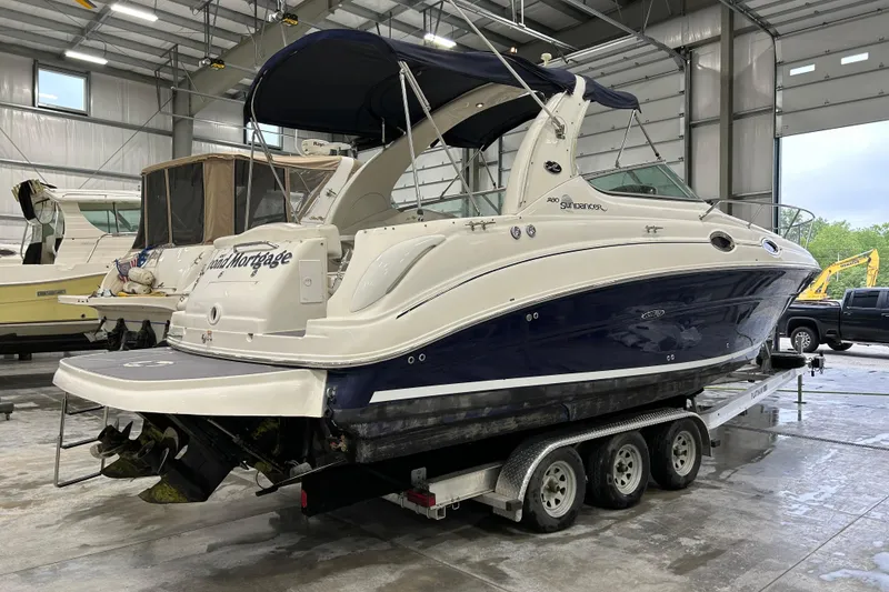 Slide: The Image of 2004 Sea Ray Sundancer 280 boat on trailer in indoor storage facility. - 1