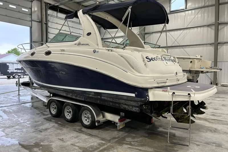 Slide: The Image of 2004 Sea Ray Sundancer 280 boat on trailer in indoor storage facility. - 2