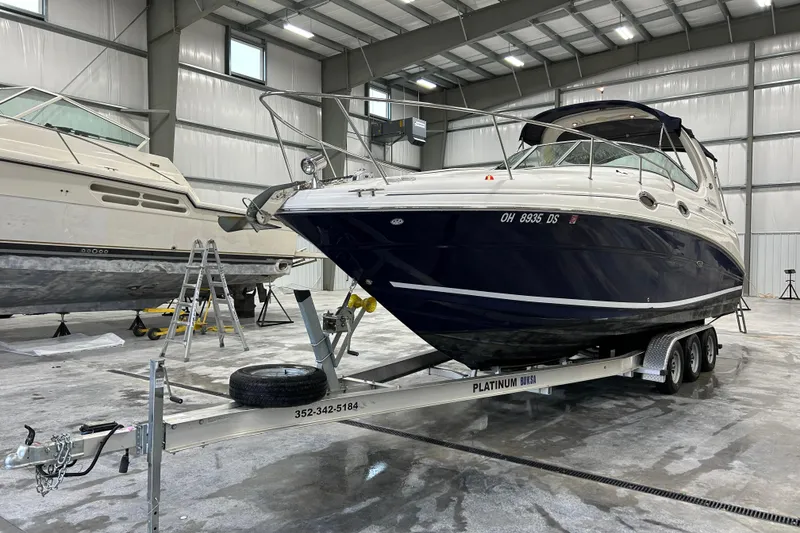 Slide: The Image of 2004 Sea Ray Sundancer 280 on trailer in indoor storage facility. - 3