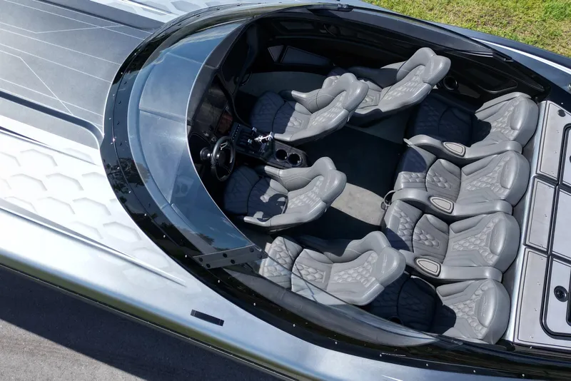 Slide: The Image of Aerial view of 2023 MTI 390X boat interior with sleek, modern seating design. - 11