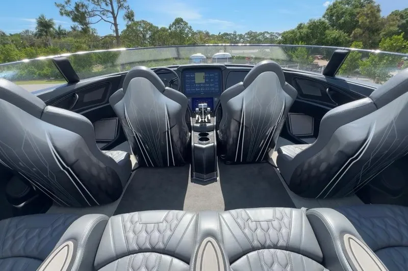Slide: The Image of Luxurious interior of 2023 MTI 390X boat with sleek seating and advanced dashboard. - 16