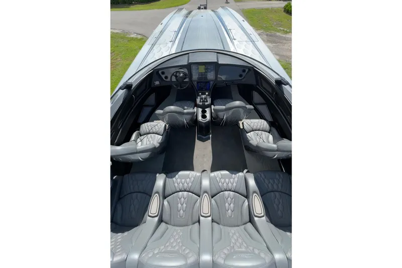Slide: The Image of Luxurious interior of 2023 MTI 390X boat with sleek gray seating and modern dashboard. - 17
