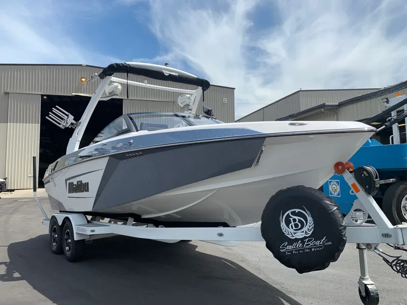 Slide: The Image of 2019 Malibu Wakesetter 23 LSV on trailer outside warehouse. - 11