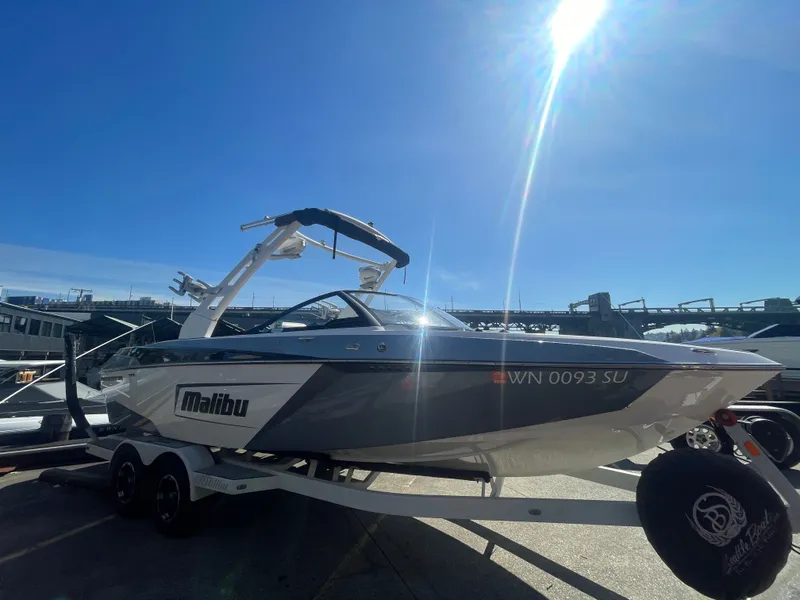 Slide: The Image of 2019 Malibu Wakesetter 23 LSV boat on trailer under sunny sky. - 3