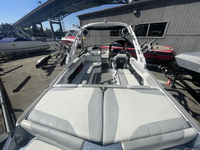 Slide: The Image of 2019 Malibu Wakesetter 23 LSV boat parked under bridge. - 4