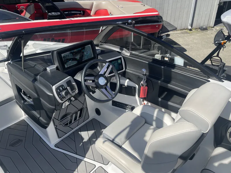 Slide: The Image of Interior of a 2019 Malibu Wakesetter 23 LSV boat with modern helm console. - 6