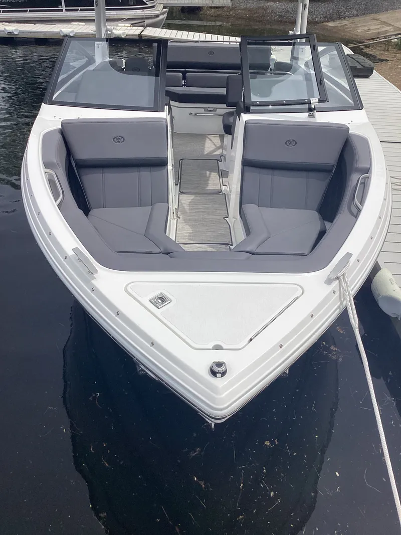 Slide: The Image of 2025 Cobalt R4 boat with gray seating at dock. - 5