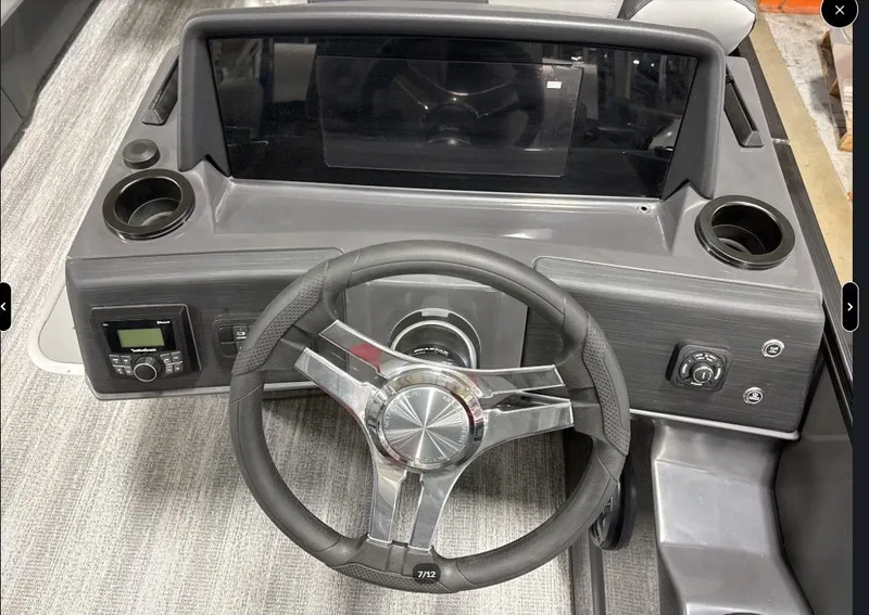Slide: The Image of Steering wheel and dashboard of a 2026 Bennington 23SSR SPS LTD TRI. - 10