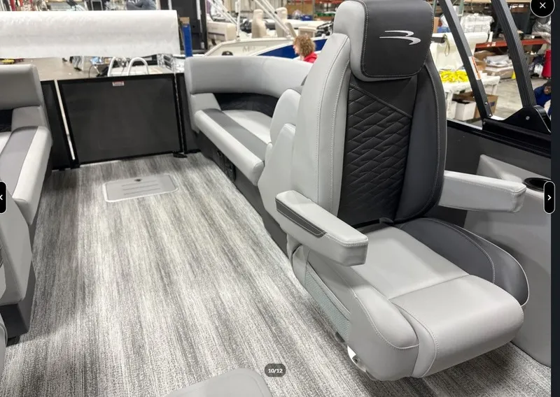 Slide: The Image of Interior of 2026 Bennington 23SSR SPS LTD TRI with luxurious seating. - 12