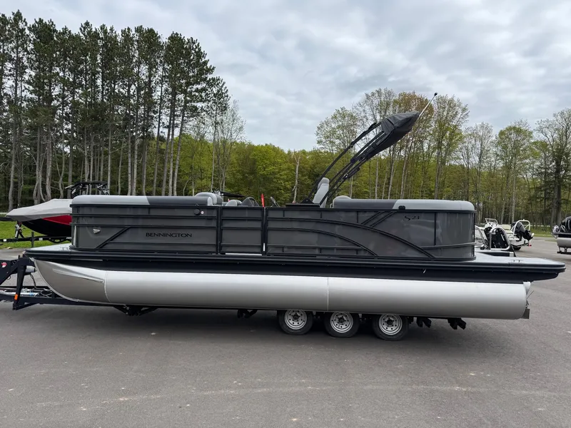 Slide: The Image of 2026 Bennington 23SSR SPS LTD TRI pontoon boat on trailer. - 14