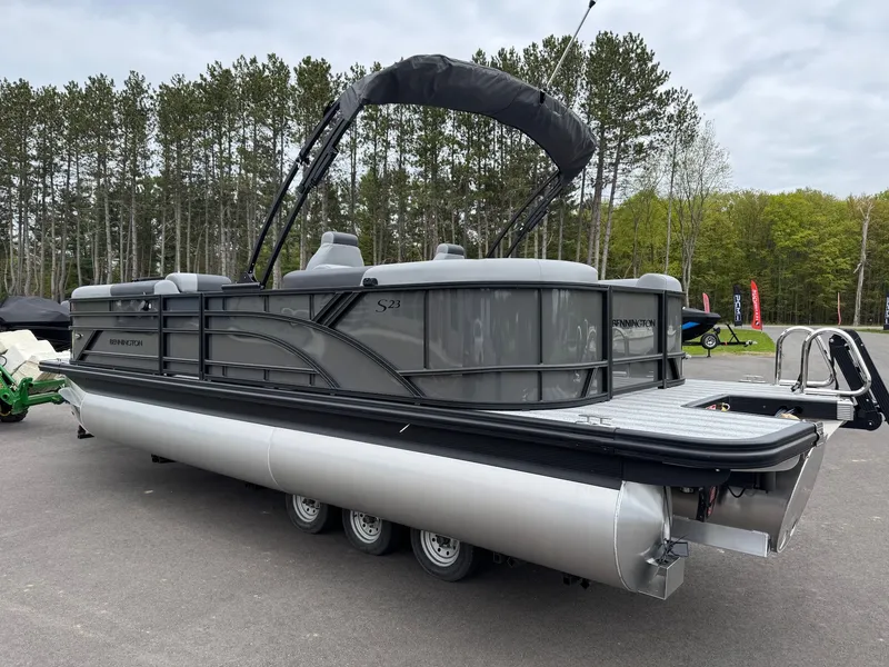 Slide: The Image of 2026 Bennington 23SSR SPS LTD TRI pontoon boat parked outdoors. - 16