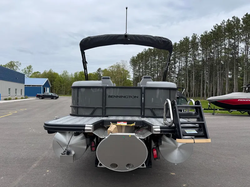 Slide: The Image of 2026 Bennington 23SSR SPS LTD TRI pontoon boat in parking lot. - 17