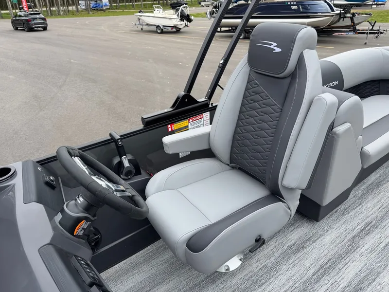 Slide: The Image of Interior of 2026 Bennington 23SSR SPS LTD TRI with gray seating. - 27