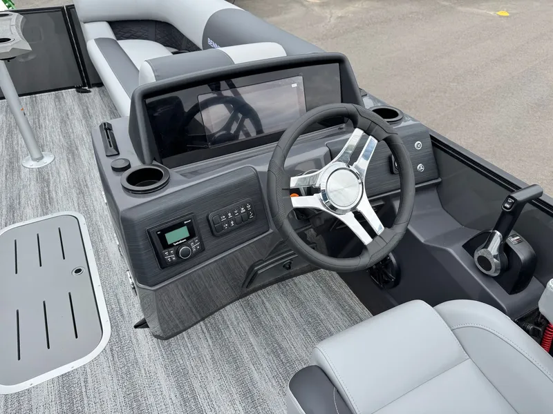 Slide: The Image of Interior of 2026 Bennington 23SSR SPS LTD TRI with steering wheel and console. - 28
