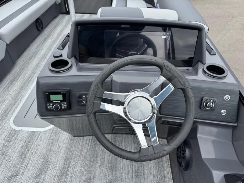 Slide: The Image of Steering wheel and dashboard of Bennington 23SSR SPS LTD TRI 2026. - 29